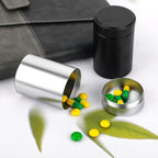 COMNICO 2pcs Portable Metal Pill Organizer, Round Daily Pill Box Holder Pocket Small Pill Case Medicine Organizer Vitamin Bottle Containers for Traveling Outdoor Fish Oils Supplements (Black+Silver)
